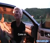 A blonde fucks a man in his car for money